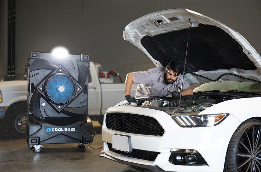 Cool Boss evaporative air cooler being used in an automotive garage