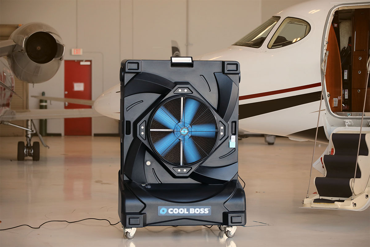 Cool Boss commercial evaporative air cooler in a large workspace