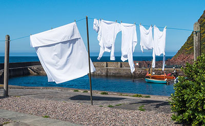 Hang wet sheets and linen