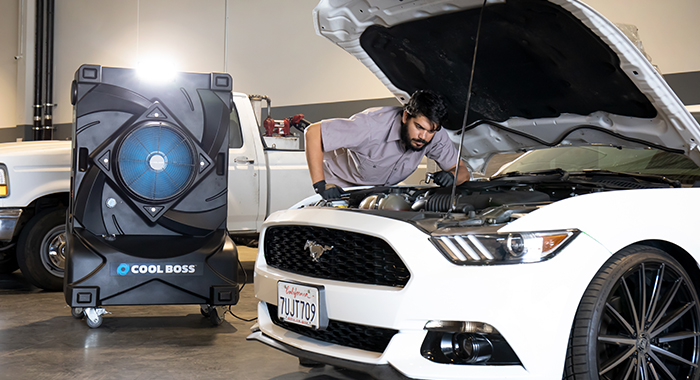 Cool Boss portable evaporative cooler in an automotive shop
